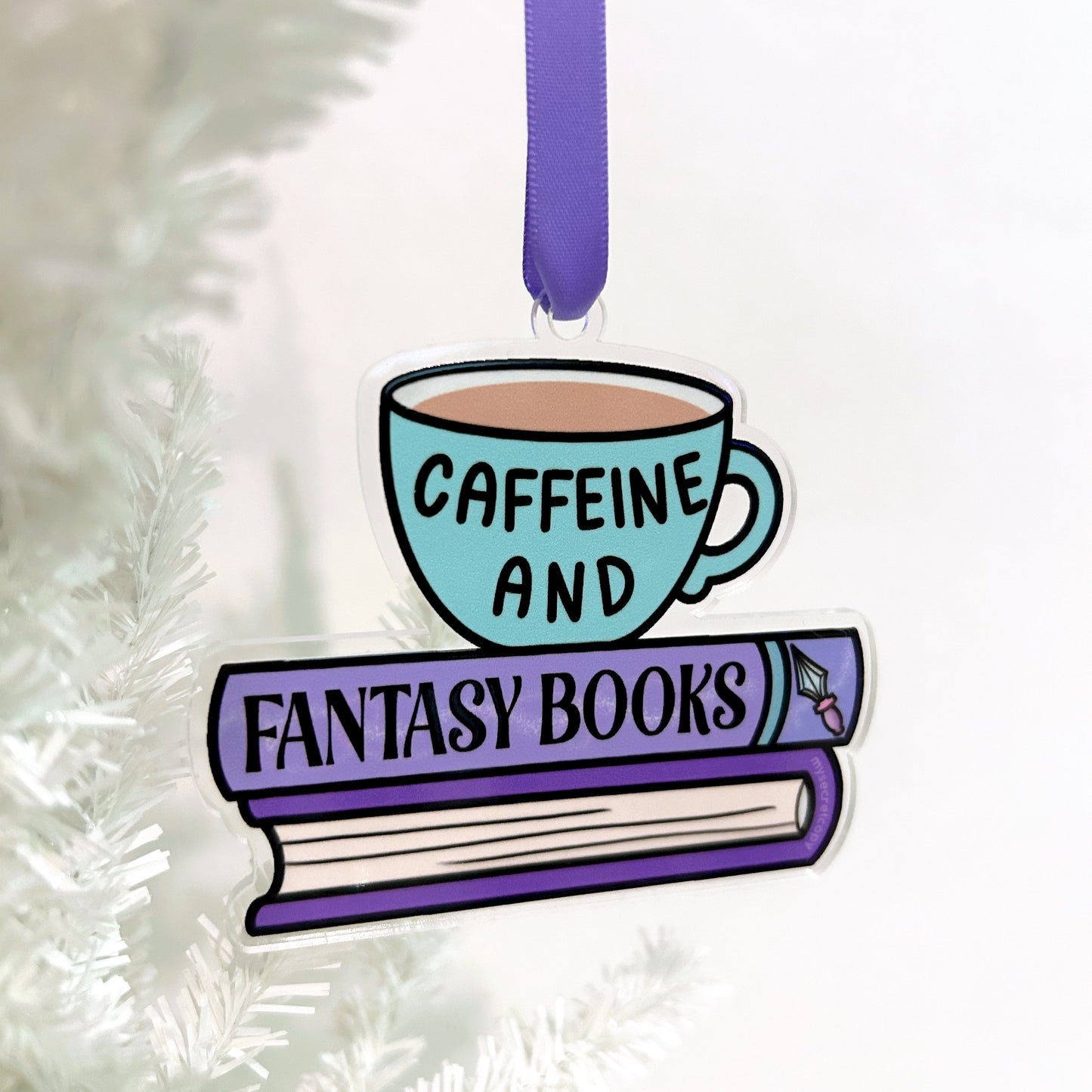 Decorative ornament with a cup of coffee and a book titled 'Caffeine and Fantasy Books' on a white background.