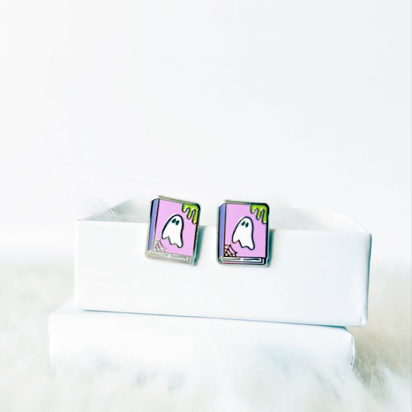 earrings with ghost design on a white shirt collar