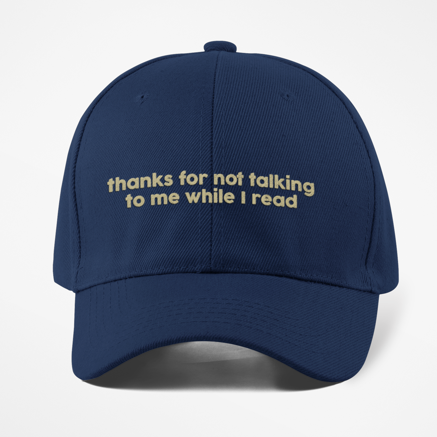 Navy blue cap with yellow text on a white background
