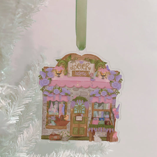 Decorative ornament with a cottagecore bookstore design on a white christmas tree and white background