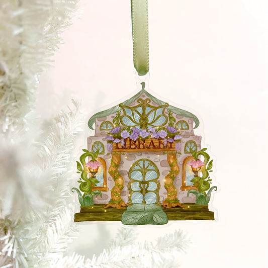 Decorative ornament shaped like a fairy house library  on a white tinsel background
