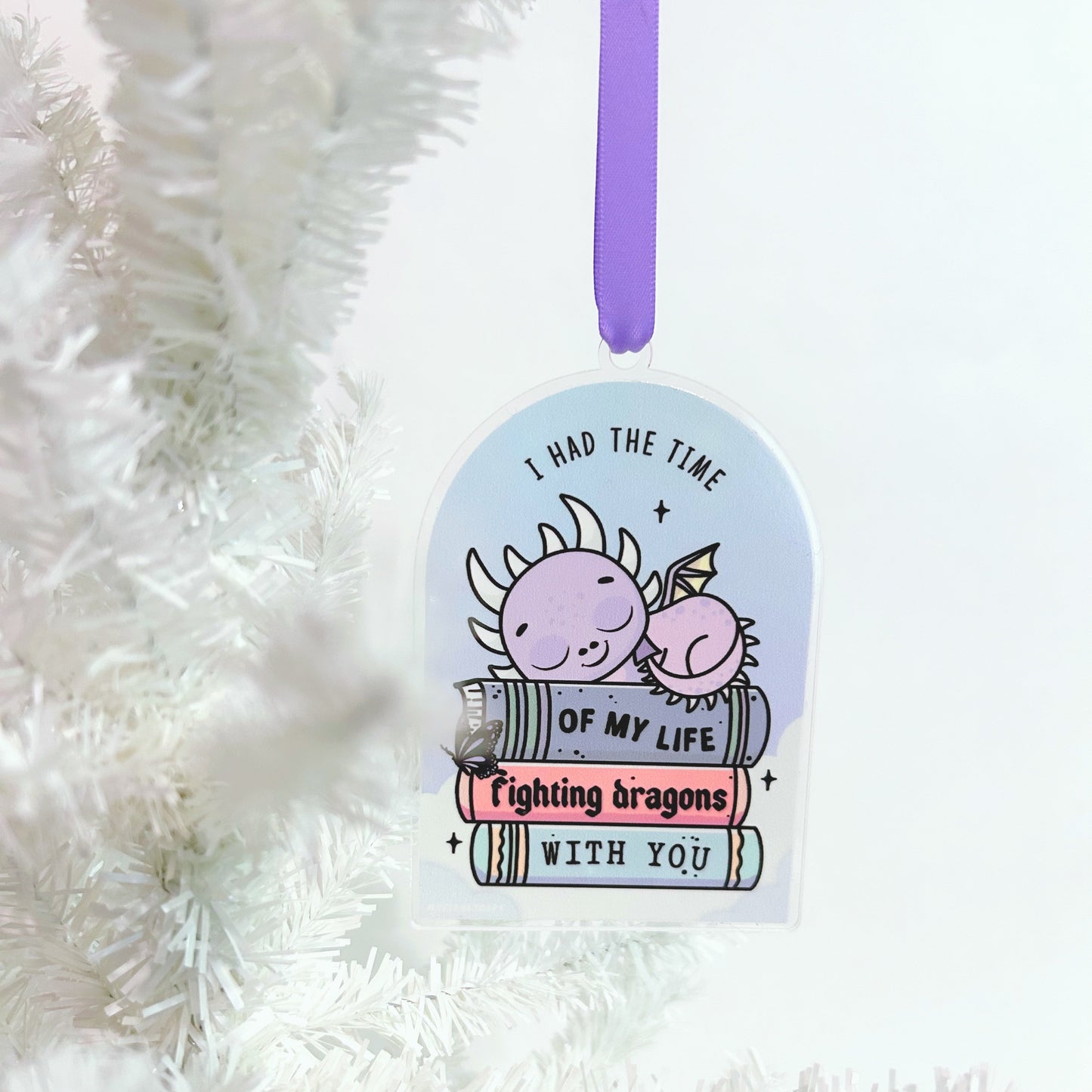 Decorative tag with dragon illustration and text on a white textured background