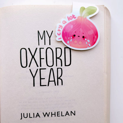 I cry a lot bookmark clipped on a book titled 'My Oxford Year' by Julia Whelan on a white background