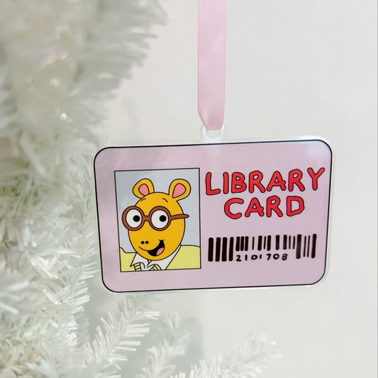Children's library card with cartoon character on a white textured background