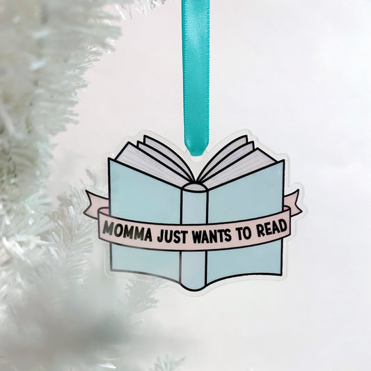 Decorative book ornament with 'Momma just wants to read' text on a white background