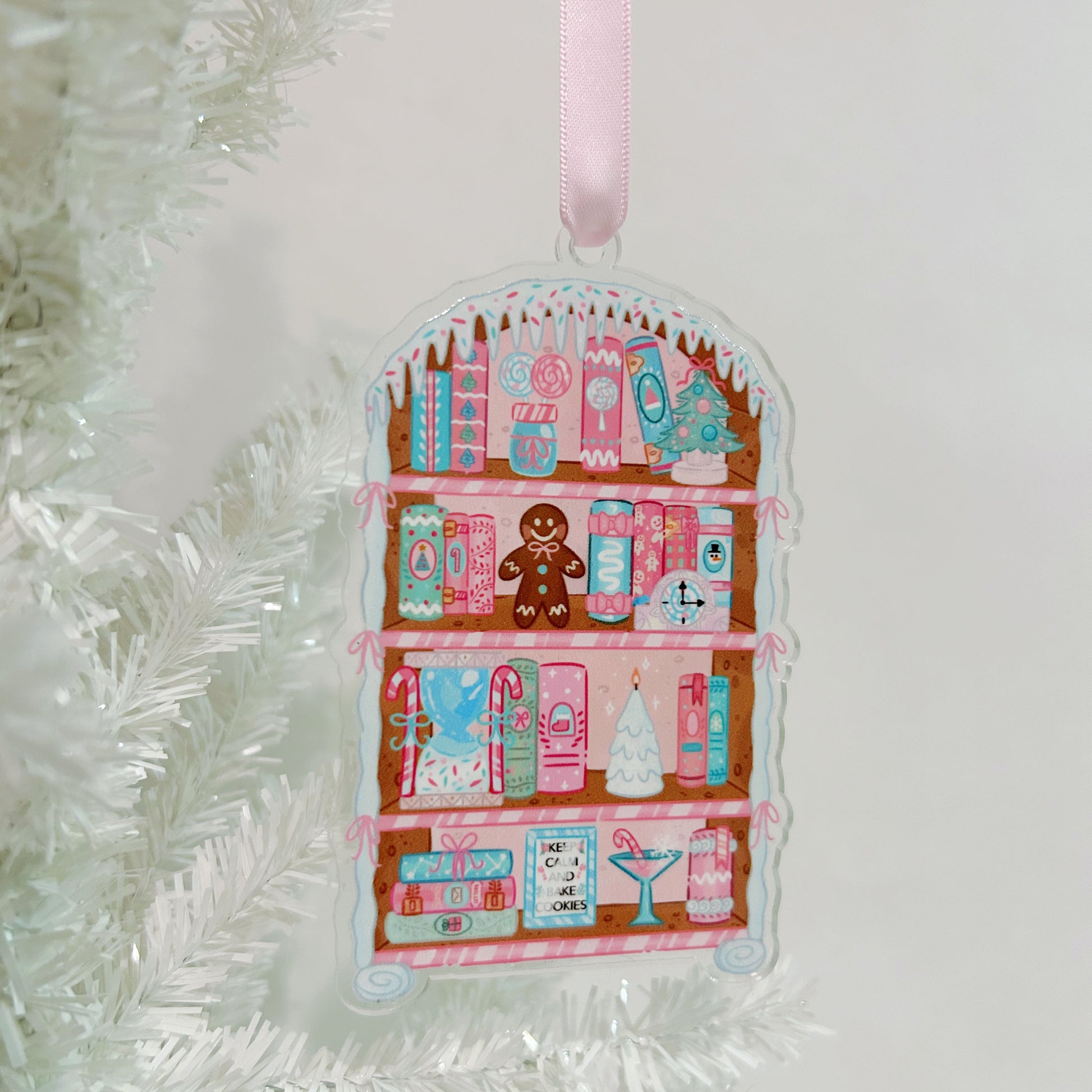 Decorative ornament withPink Gingerbread Bookshelf design on a white background