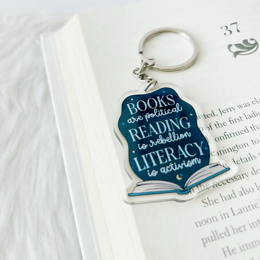 Keychain with book-themed design on a book page