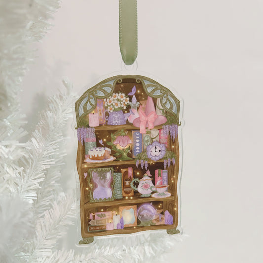 Decorative ornament with a miniature cottagecore bookshelf on a white tree