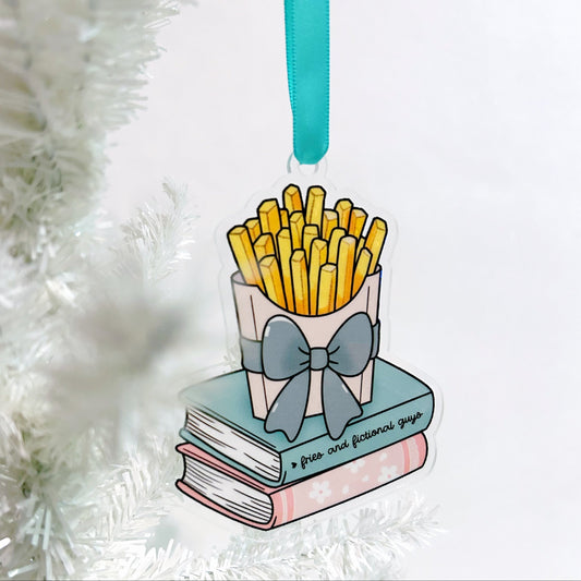 ornament with books and fries on a white tree with a book titled fries and fictional guys