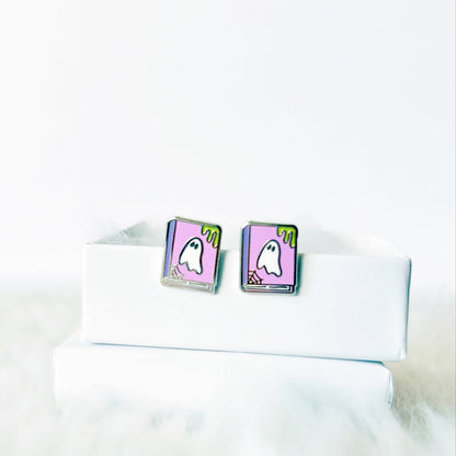 earrings with ghost design on a white shirt collar