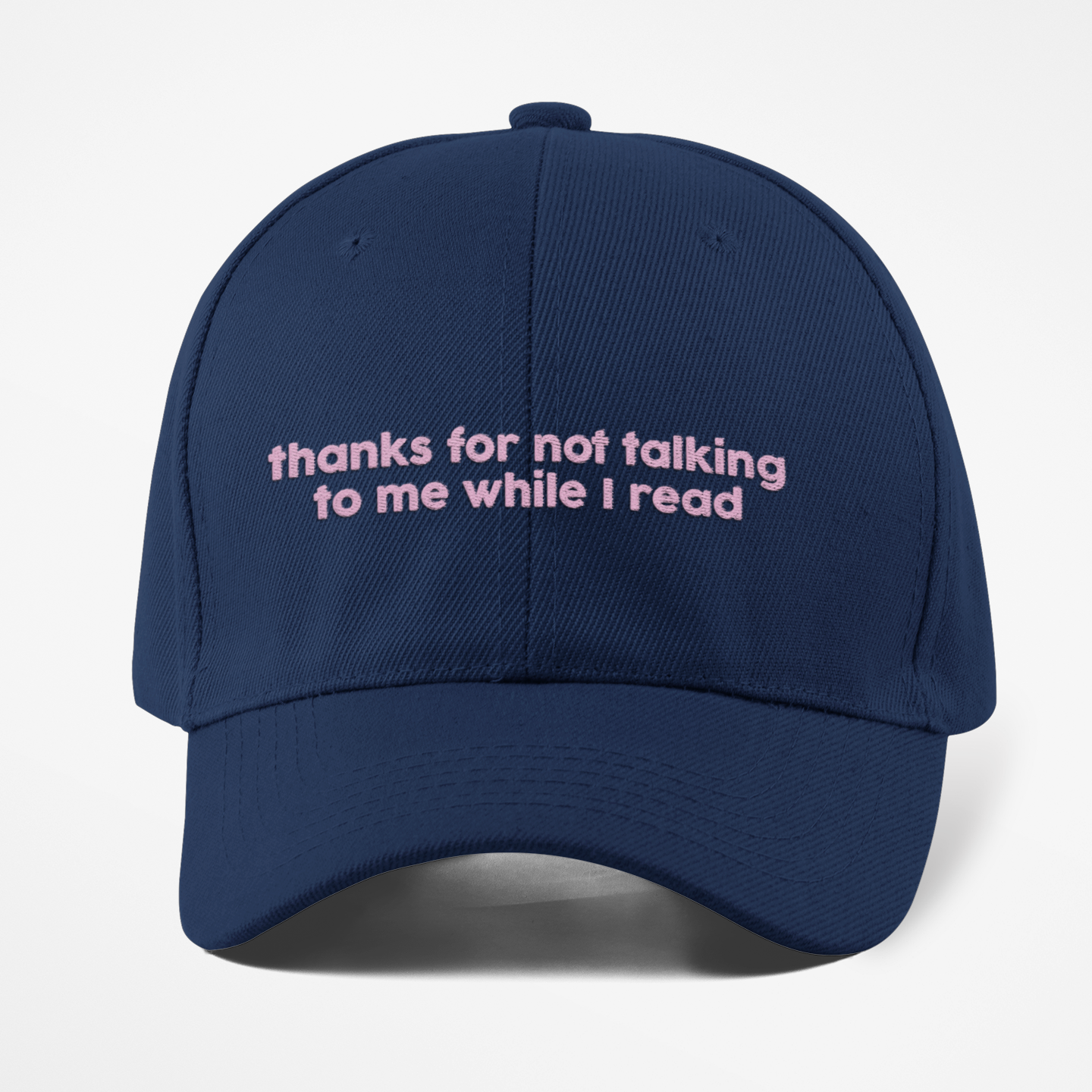 Navy blue cap with pink text on a white background