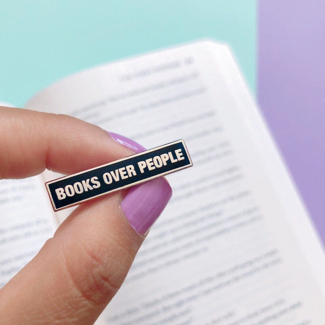 Mini Books Over People Enamel Pin